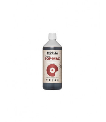 Botella de fertilizante Top Max, para el ciclo floral de las plantas.